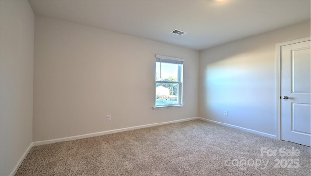 unfurnished room with light carpet