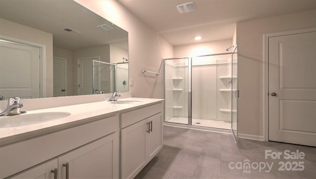 bathroom with vanity and an enclosed shower