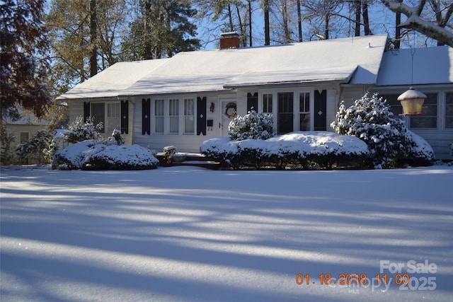 view of front of house with a chimney