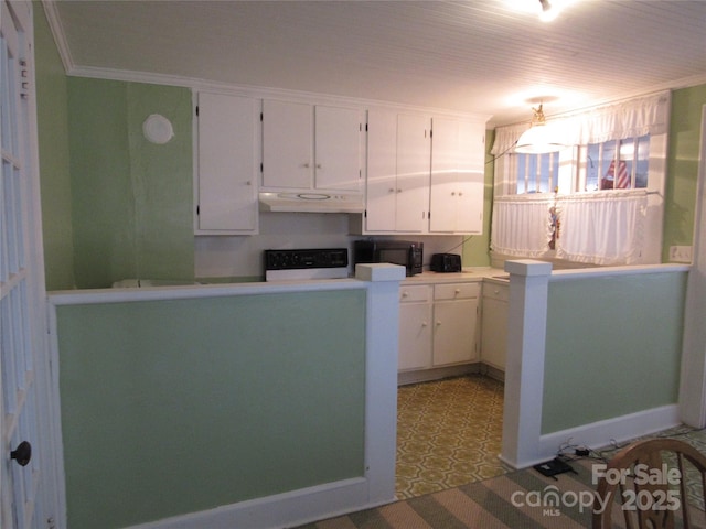 kitchen featuring white cabinets, ornamental molding, under cabinet range hood, black microwave, and stove