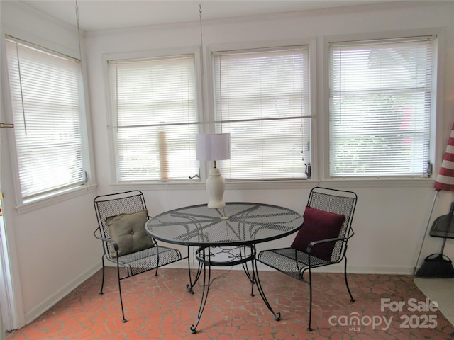 dining space featuring baseboards