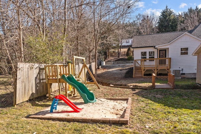 view of play area with a yard and cooling unit