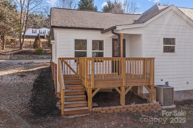 exterior space with central AC and a deck