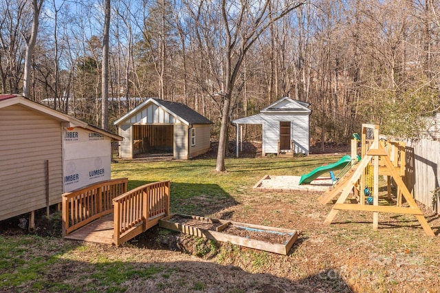 view of yard with a playground and a storage unit