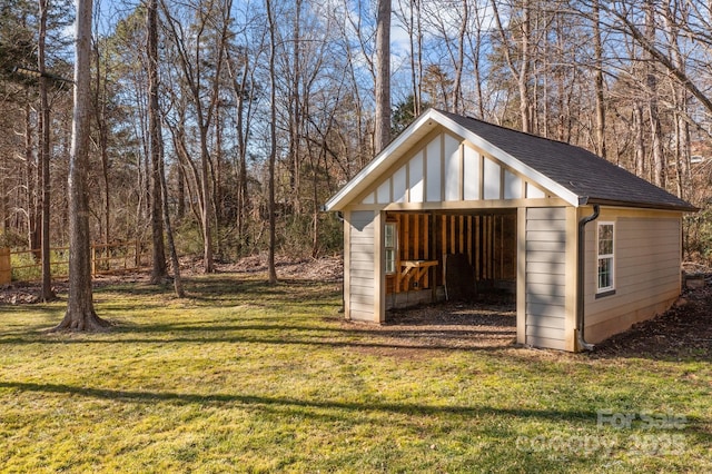 view of outbuilding featuring a lawn