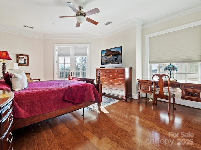 bedroom with wood-type flooring, ornamental molding, and ceiling fan