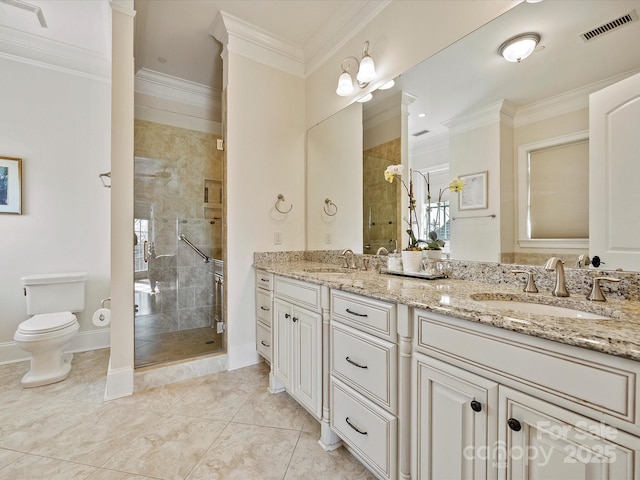 bathroom featuring ornamental molding, toilet, a shower with door, and vanity