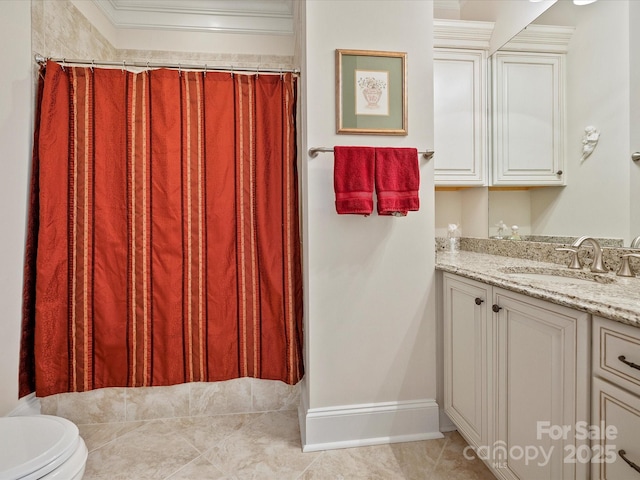 bathroom with crown molding, tile patterned floors, vanity, and toilet