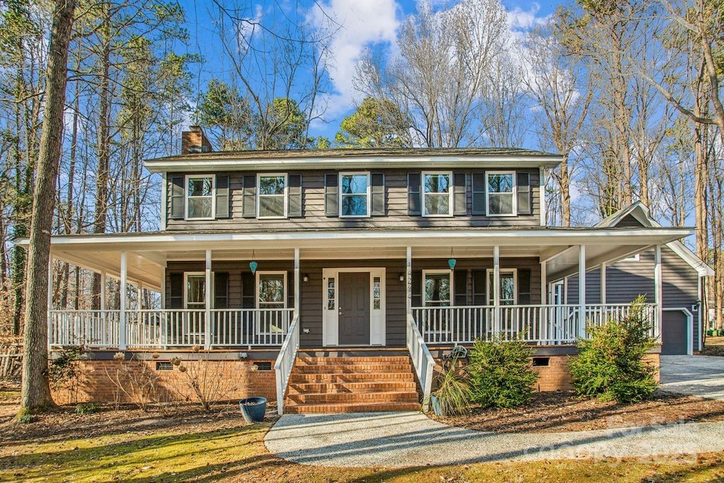 view of front of home with a garage and covered porch