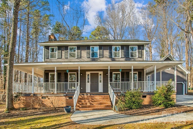 view of front of home with a garage and covered porch