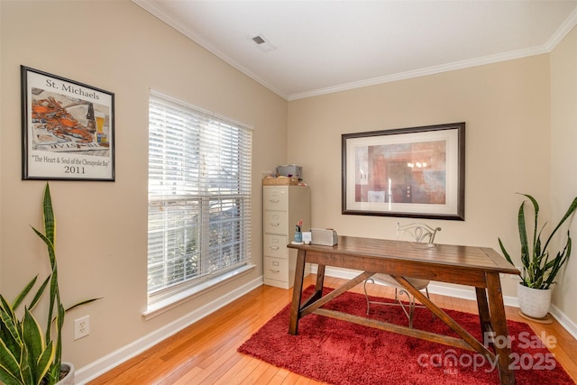 office space featuring crown molding and hardwood / wood-style floors