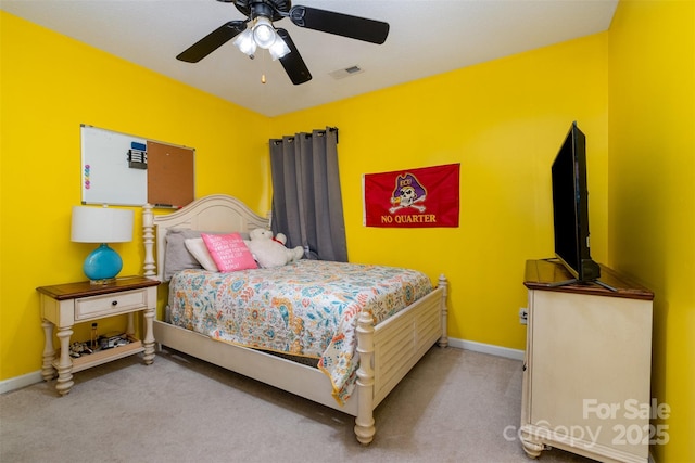 bedroom with light colored carpet and ceiling fan