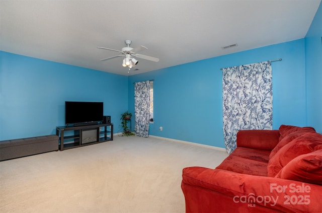 living room featuring ceiling fan and light carpet