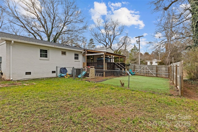 rear view of property featuring a yard