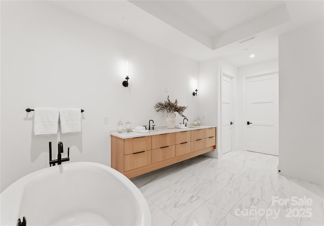 bathroom featuring a bathing tub and vanity