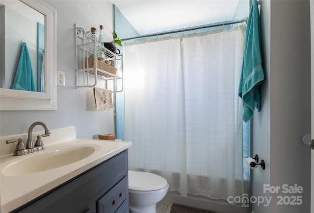 full bathroom featuring vanity, shower / bath combination with curtain, and toilet