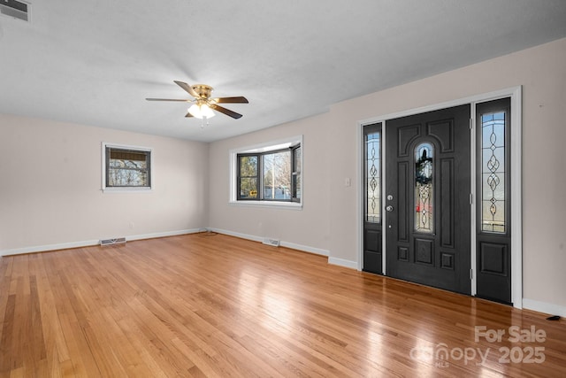 entryway with ceiling fan and light wood-type flooring