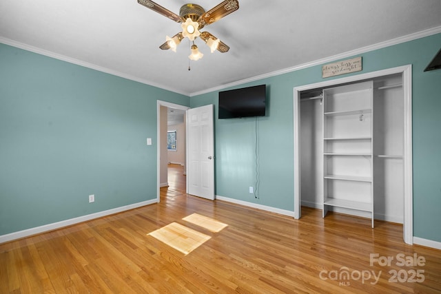 unfurnished bedroom with ceiling fan, ornamental molding, and light hardwood / wood-style flooring