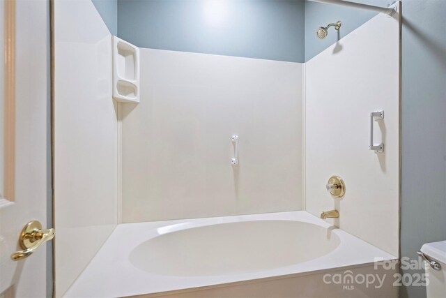 bathroom with toilet and shower / bath combination