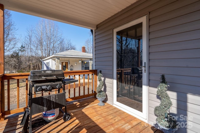 wooden deck featuring grilling area