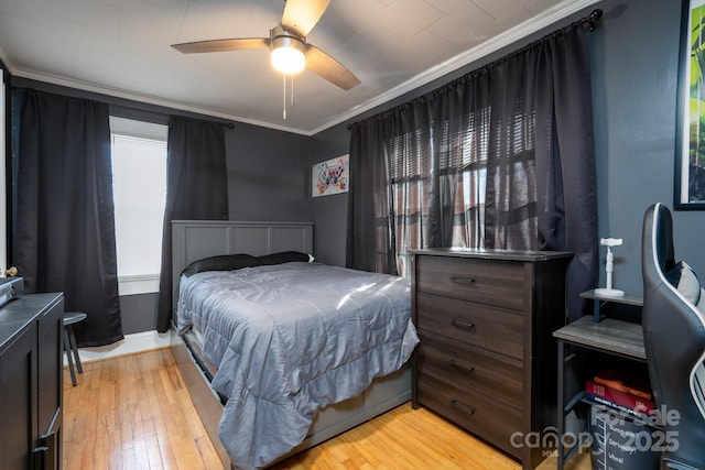 bedroom with crown molding, ceiling fan, and light wood-type flooring