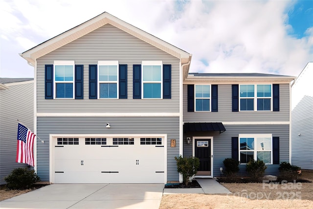 view of front of property with a garage