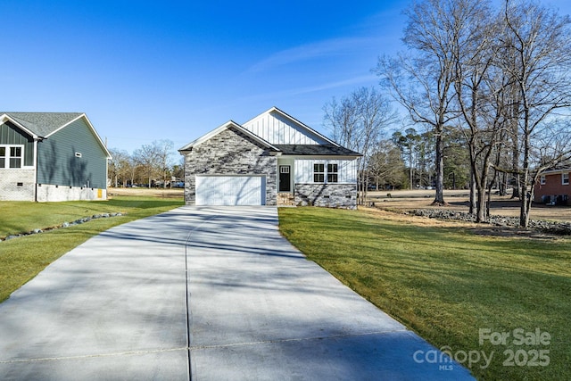 view of front of property featuring a garage and a front lawn