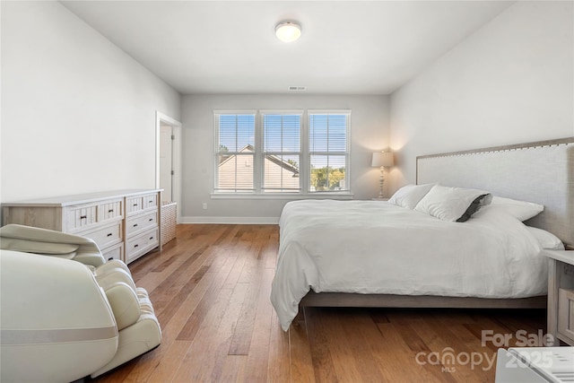 bedroom featuring light hardwood / wood-style floors