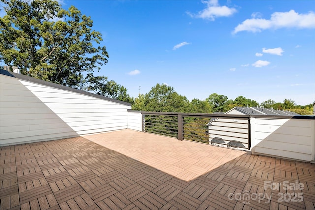 view of patio featuring a balcony