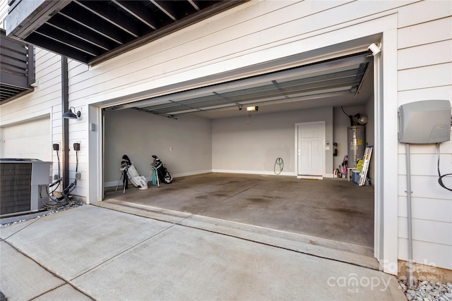 garage with a garage door opener, gas water heater, and central air condition unit