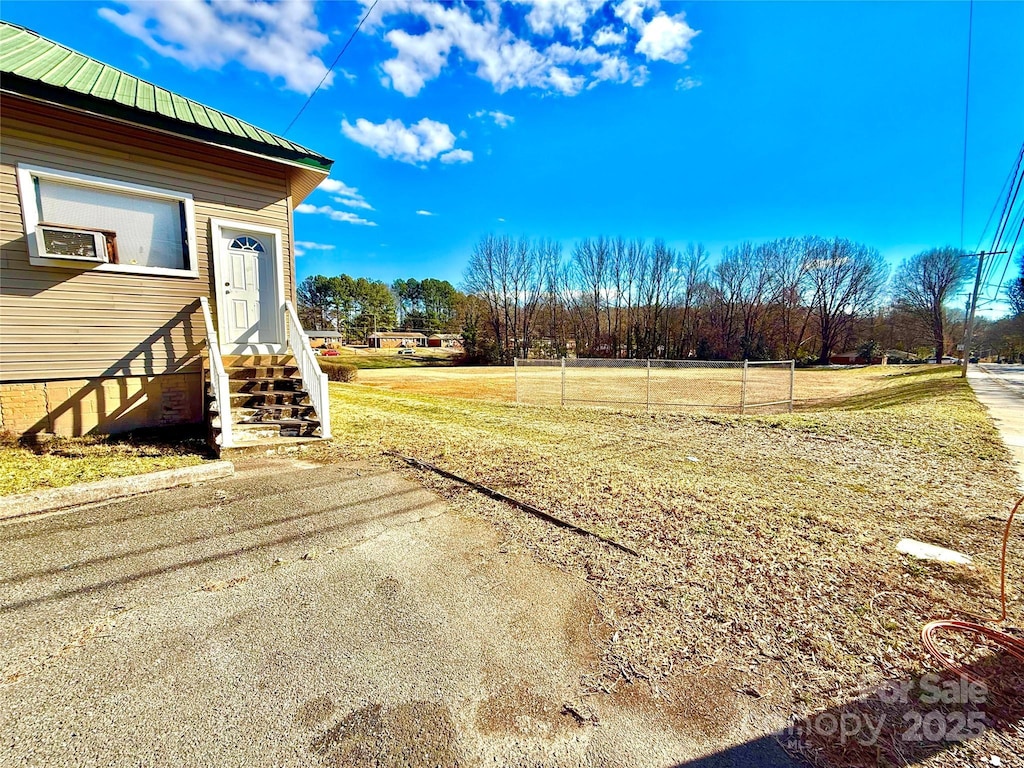 view of yard with entry steps