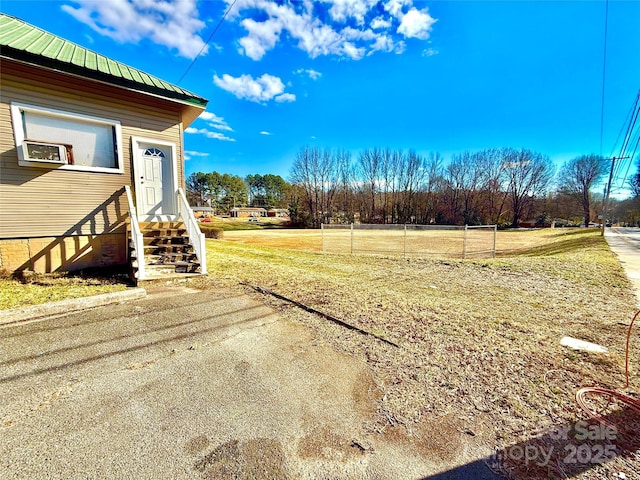 view of yard with entry steps