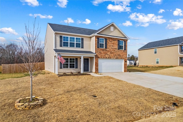 view of front of home featuring a garage and a front lawn