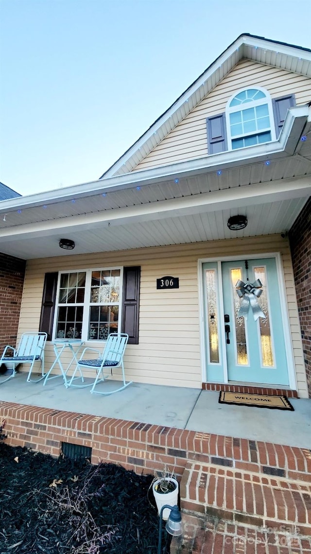 doorway to property with a porch