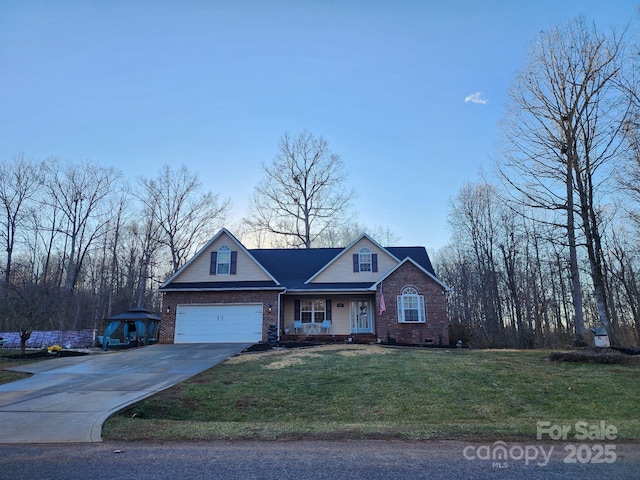 view of front of property featuring a garage and a front lawn