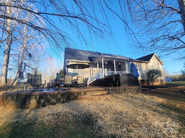 rear view of house with a trampoline