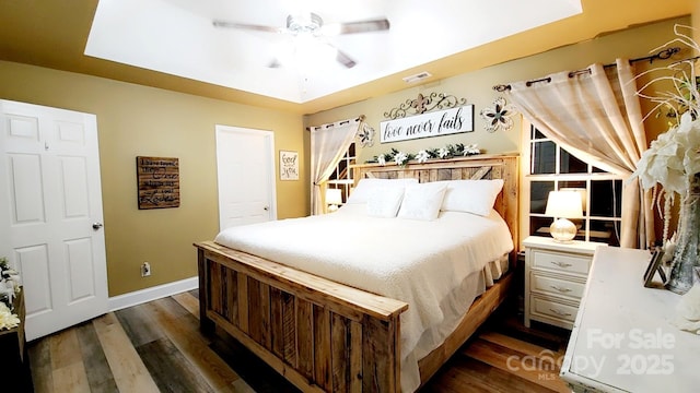 bedroom featuring dark wood-type flooring and ceiling fan