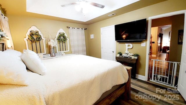 bedroom featuring dark hardwood / wood-style flooring and ceiling fan