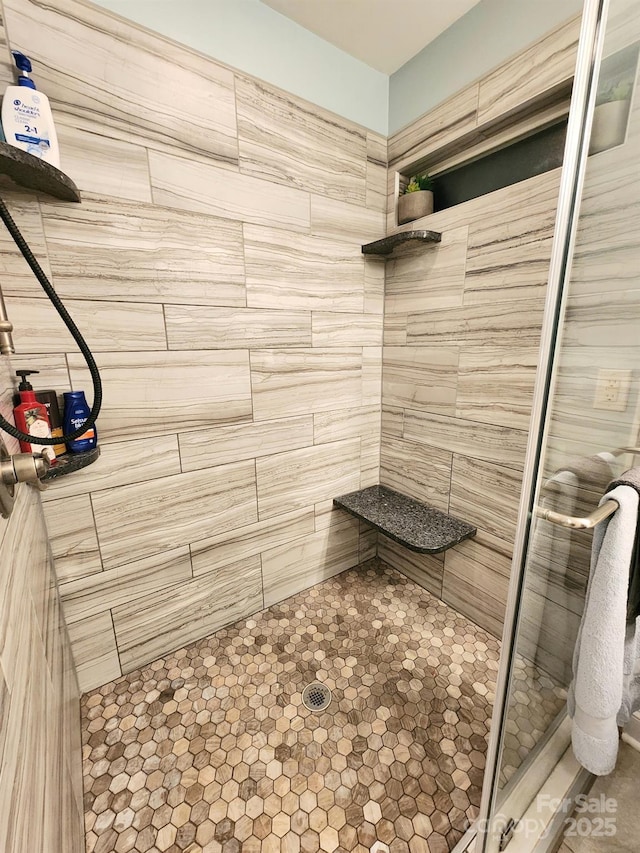 bathroom featuring an enclosed shower