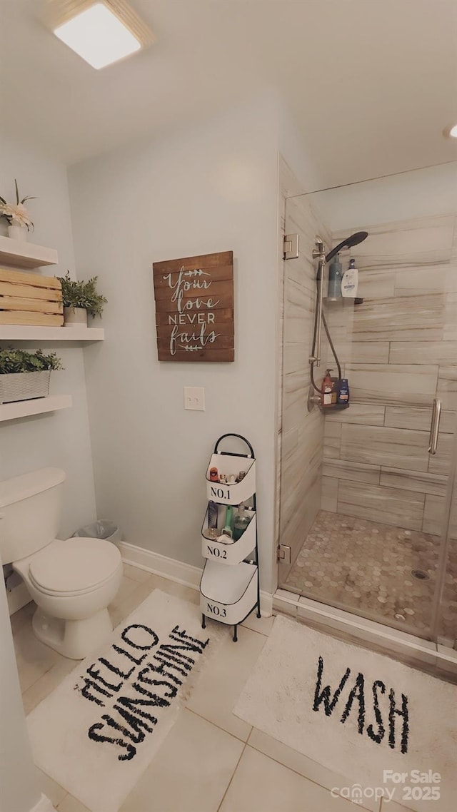 bathroom with tile patterned floors, toilet, and an enclosed shower