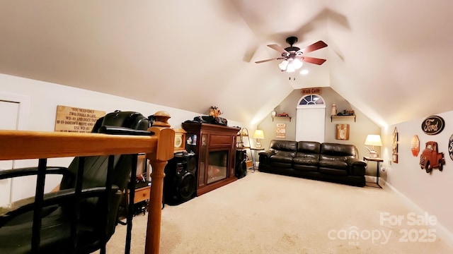 cinema featuring vaulted ceiling, ceiling fan, and carpet flooring