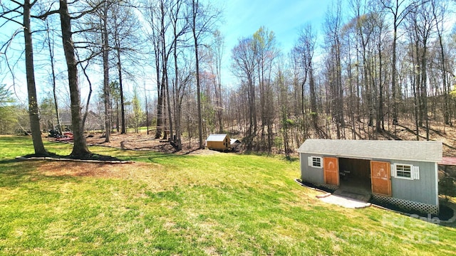 306 Bluegill Ln, Statesville, NC 28625 - view of yard featuring a storage shed and an outdoor structure
