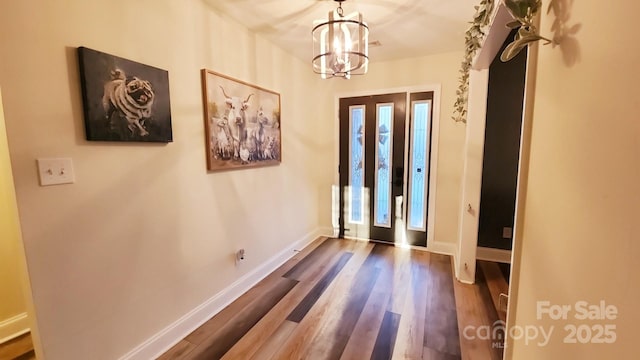 306 Bluegill Ln, Statesville, NC 28625 - entryway with baseboards, a notable chandelier, and dark wood finished floors