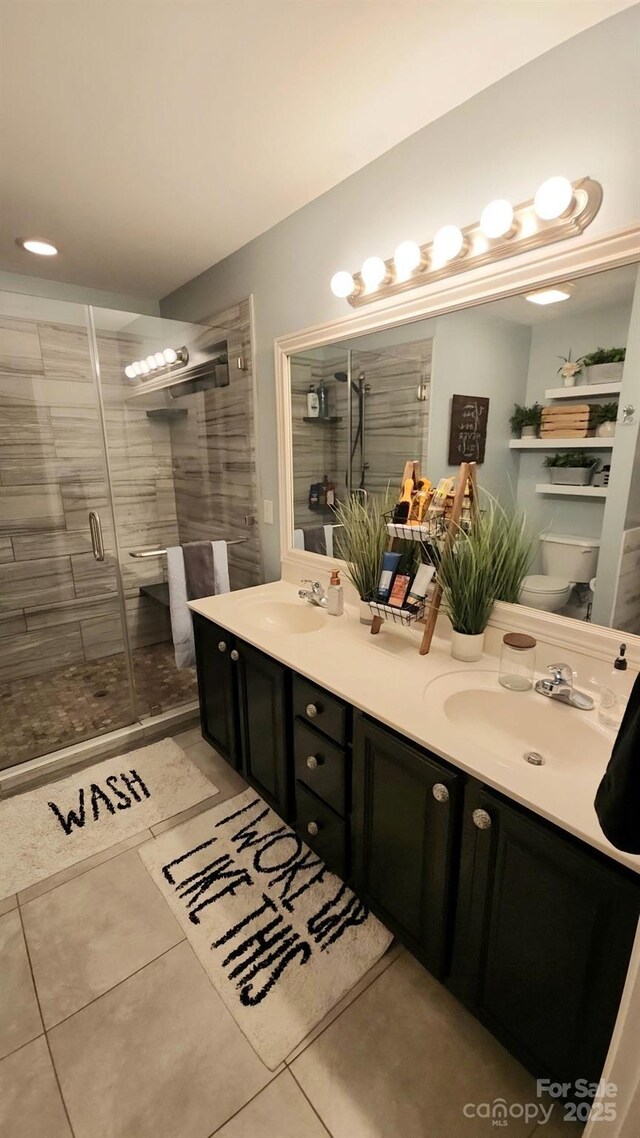 306 Bluegill Ln, Statesville, NC 28625 - bathroom featuring a sink, a shower stall, double vanity, and toilet