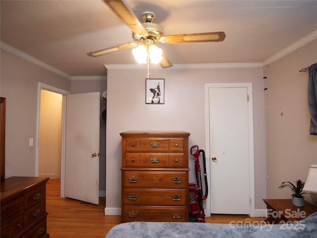 bedroom with light hardwood / wood-style flooring, ornamental molding, and ceiling fan