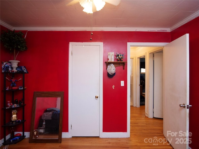 bedroom with hardwood / wood-style flooring and ornamental molding