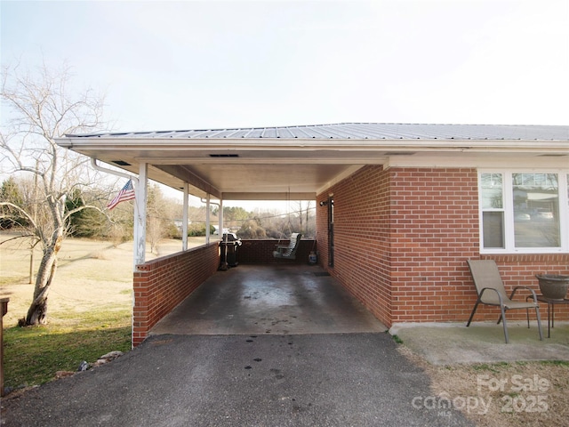 view of parking / parking lot with a carport