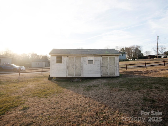 view of outdoor structure with a yard