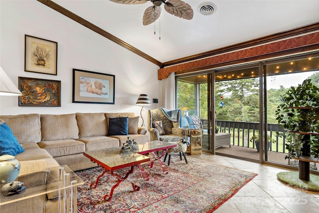 tiled living room featuring crown molding, vaulted ceiling, and ceiling fan