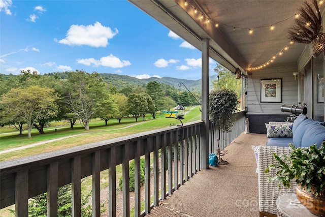 balcony featuring a mountain view